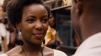 Movie still from “Sense8” (2015), directed by Tom Tykwer – A person wearing a necklace; Close Up shot, Over the shoulder angle