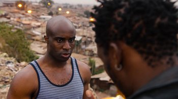 Movie still from “Sense8” (2015), directed by Tom Tykwer – A man and a woman are standing in front of each other; Close Up shot, Over the shoulder angle