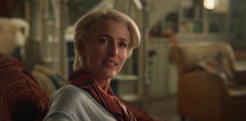 Movie still from “Sex Education” (2019), created by Laurie Nunn – A person wearing a scarf; Close Up shot, Over the shoulder angle