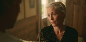 Movie still from “Sex Education” (2019), created by Laurie Nunn – A person sitting in a room near a window; Close Up shot, Over the shoulder angle
