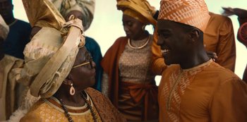Movie still from “Sex Education” (2019), created by Laurie Nunn – A group of people standing next to each other; Medium shot, Over the shoulder angle