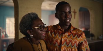 Movie still from “Sex Education” (2019), created by Laurie Nunn – An older woman standing next to a young man; Close Up shot, Over the shoulder angle