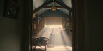 Movie still from “Sex Education” (2019), created by Laurie Nunn – Sunlight streaming through a window into a room; Wide shot, High angle