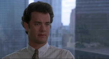 Movie still from “Sleepless in Seattle” (1993), directed by Nora Ephron – A man wearing a striped shirt and a tie; Close Up shot, Over the shoulder angle