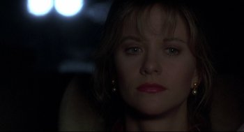 Movie still from “Sleepless in Seattle” (1993), directed by Nora Ephron – A woman's face in the dark; Close Up shot, Low angle