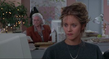 Movie still from “Sleepless in Seattle” (1993), directed by Nora Ephron – A woman sitting in front of a computer monitor; Close Up shot, Over the shoulder angle