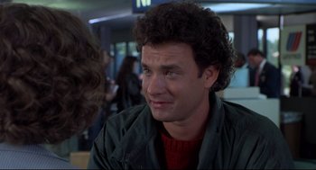 Movie still from “Sleepless in Seattle” (1993), directed by Nora Ephron – A person with curly hair; Close Up shot, Over the shoulder angle