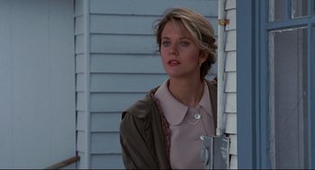 Movie still from “Sleepless in Seattle” (1993), directed by Nora Ephron – A woman standing in front of a building; Close Up shot, Low angle