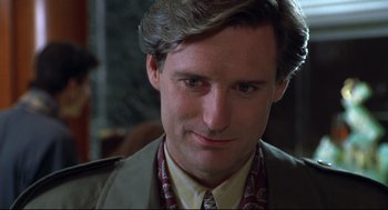 Movie still from “Sleepless in Seattle” (1993), directed by Nora Ephron – A person wearing a suit and tie; Close Up shot, Over the shoulder angle