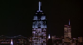 Movie still from “Sleepless in Seattle” (1993), directed by Nora Ephron – The empire state building is lit up at night; Extreme Wide shot, Low angle