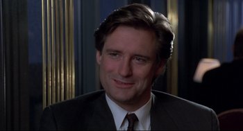 Movie still from “Sleepless in Seattle” (1993), directed by Nora Ephron – A person wearing a suit and tie; Close Up shot, Low angle