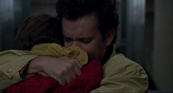Movie still from “Sleepless in Seattle” (1993), directed by Nora Ephron – A man holding a child in his arms; Close Up shot, Low angle