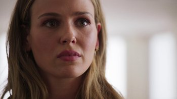 Movie still from “Sniper: Rogue Mission” (2022), directed by Oliver Thompson – A woman's face looking to her left; Close Up shot, Low angle