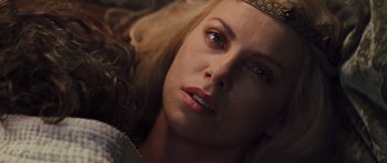 Movie still from “Snow White and the Huntsman” (2012), directed by Rupert Sanders – A person with a crown on their head; Close Up shot, Overhead angle