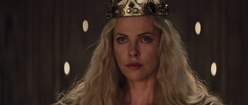 Movie still from “Snow White and the Huntsman” (2012), directed by Rupert Sanders – A woman with long blonde hair wearing a crown; Close Up shot, Low angle