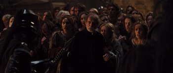 Movie still from “Snow White and the Huntsman” (2012), directed by Rupert Sanders – A group of people standing in a room; Medium shot, Over the shoulder angle
