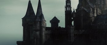 Movie still from “Snow White and the Huntsman” (2012), directed by Rupert Sanders – A castle with a clock tower in the background; Extreme Wide shot, High angle