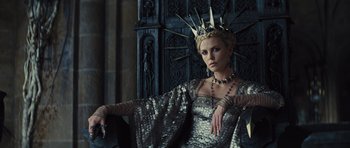 Movie still from “Snow White and the Huntsman” (2012), directed by Rupert Sanders – Charlize theron as the evil queen in the movie snow white and the seven dwarfs; Medium shot, Low angle