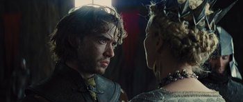 Movie still from “Snow White and the Huntsman” (2012), directed by Rupert Sanders – A man and a woman face to face in a dark room; Close Up shot, Over the shoulder angle