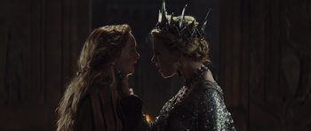 Movie still from “Snow White and the Huntsman” (2012), directed by Rupert Sanders – Two women are facing each other in a dark room; Close Up shot, Over the shoulder angle