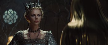 Movie still from “Snow White and the Huntsman” (2012), directed by Rupert Sanders – Charlize theron as the evil queen in snow white and the seven dwarfs; Close Up shot, Over the shoulder angle