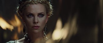 Movie still from “Snow White and the Huntsman” (2012), directed by Rupert Sanders – Charlize theron in a scene from the movie prometheus; Close Up shot, Over the shoulder angle