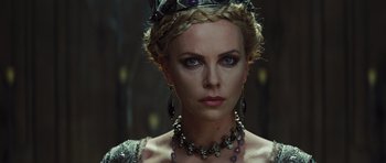 Movie still from “Snow White and the Huntsman” (2012), directed by Rupert Sanders – Charlize theron as queen ravenna in the hunchback of notre dame; Close Up shot, Over the shoulder angle