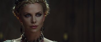 Movie still from “Snow White and the Huntsman” (2012), directed by Rupert Sanders – A person wearing a necklace; Close Up shot, Over the shoulder angle