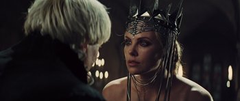 Movie still from “Snow White and the Huntsman” (2012), directed by Rupert Sanders – A person wearing a crown; Close Up shot, Over the shoulder angle