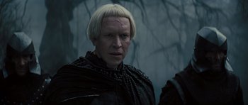 Movie still from “Snow White and the Huntsman” (2012), directed by Rupert Sanders – A person wearing a costume; Close Up shot, Over the shoulder angle