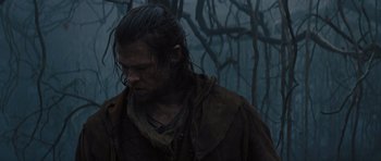 Movie still from “Snow White and the Huntsman” (2012), directed by Rupert Sanders – A man with wet hair standing in the rain; Close Up shot, Low angle