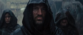 Movie still from “Snow White and the Huntsman” (2012), directed by Rupert Sanders – A person wearing a hooded jacket; Close Up shot, Low angle