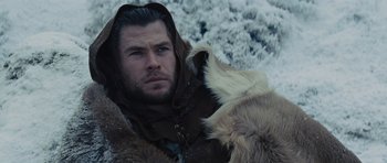 Movie still from “Snow White and the Huntsman” (2012), directed by Rupert Sanders – A person with a dog; Close Up shot, Low angle