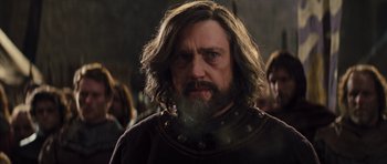 Movie still from “Snow White and the Huntsman” (2012), directed by Rupert Sanders – A man with long hair and a beard; Close Up shot, Low angle
