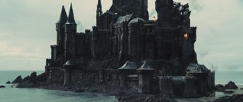 Movie still from “Snow White and the Huntsman” (2012), directed by Rupert Sanders – A large castle with towers and a castle like structure on top of a hill; Extreme Wide shot, High angle