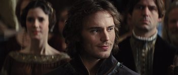 Movie still from “Snow White and the Huntsman” (2012), directed by Rupert Sanders – A person with long brown hair; Close Up shot, Over the shoulder angle