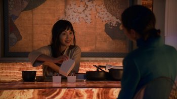 Movie still from “Snowpiercer” (2020), created by Graeme Manson – A woman sitting at a table in front of another woman; Medium shot, Over the shoulder angle