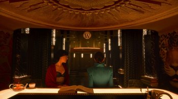 Movie still from “Snowpiercer” (2020), created by Graeme Manson – Two people sitting at a table in front of a clock; Medium shot, Low angle