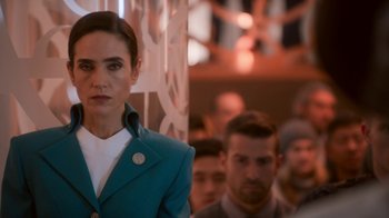 Movie still from “Snowpiercer” (2020), created by Graeme Manson – A woman standing in front of a group of people; Close Up shot, Over the shoulder angle