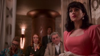 Movie still from “Snowpiercer” (2020), created by Graeme Manson – A group of people sitting in a room; Medium shot, Low angle