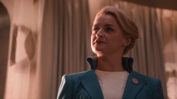 Movie still from “Snowpiercer” (2020), created by Graeme Manson – A woman wearing a blue jacket looking to her left; Close Up shot, Low angle