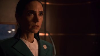 Movie still from “Snowpiercer” (2020), created by Graeme Manson – A woman wearing a green jacket looking at the camera; Close Up shot, Low angle