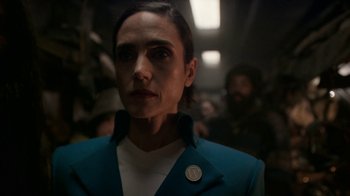 Movie still from “Snowpiercer” (2020), created by Graeme Manson – A woman in a blue jacket is looking at the camera; Close Up shot, Over the shoulder angle