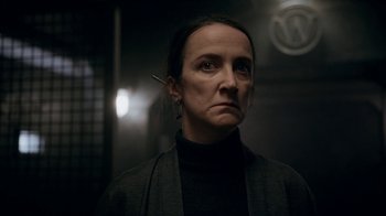 Movie still from “Snowpiercer” (2020), created by Graeme Manson – A woman in a black jacket with a cigarette in her mouth; Close Up shot, Low angle