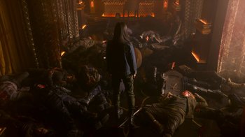Movie still from “Snowpiercer” (2020), created by Graeme Manson – A group of people laying on the ground in a room; Wide shot, High angle