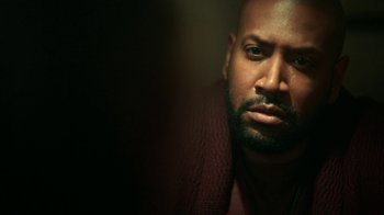 Movie still from “Snowpiercer” (2020), created by Graeme Manson – A person wearing a sweater; Close Up shot, Low angle