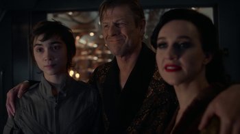 Movie still from “Snowpiercer” (2020), created by Graeme Manson – A man and two women standing next to each other in a room; Medium shot, Over the shoulder angle