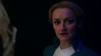 Movie still from “Snowpiercer” (2020), created by Graeme Manson – A person wearing a green jacket; Close Up shot, Over the shoulder angle