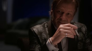 Movie still from “Snowpiercer” (2020), created by Graeme Manson – A person holding a cell phone; Close Up shot, Over the shoulder angle