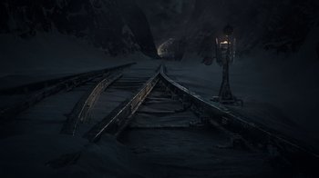 Movie still from “Snowpiercer” (2020), created by Graeme Manson – An empty train track in the dark; Extreme Wide shot, High angle